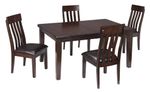 A dark wood dining table set with four matching chairs, each with vertical slat backs and cushioned seats, arranged around the table.