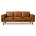 A modern three-seater sofa with a sleek, minimalist design. The sofa is upholstered in a rich tan leather, giving it a luxurious and warm appearance. It features a clean-lined structure with three cushioned seats and matching backrests, each with a slightly tufted surface for added texture and comfort. The armrests are thick and padded, extending vertically to align with the backrests, contributing to a cohesive and sturdy look. The base of the sofa is supported by four angled wooden legs in a natural finish, adding a mid-century modern touch to the overall aesthetic. The background is a plain white, which highlights the sofa's design and color.