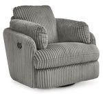 A cozy, modern armchair with a plush, ribbed fabric upholstery in a soft gray color. The chair features a wide, cushioned seat and backrest, with thick, padded armrests that curve gently outward for added comfort. The chair sits on a circular base, allowing it to swivel, and is set against a plain white background, highlighting its luxurious texture and contemporary style.